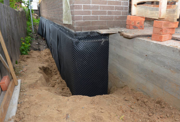 Happy homeowners after waterproofing job in Wren